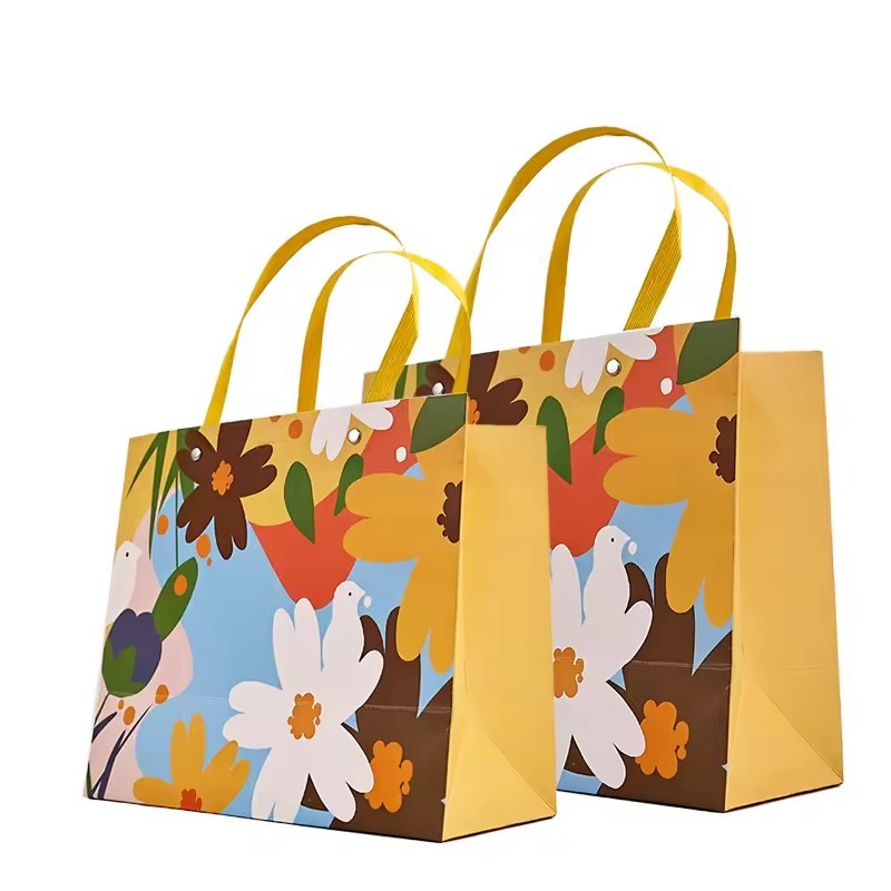 Luxury gift paper bag with your logo jewelry portable promotional oem competitive biodegradable paper bag foil